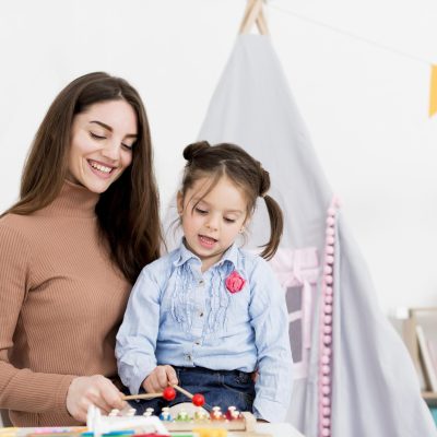 woman-playing-with-young-girl-home